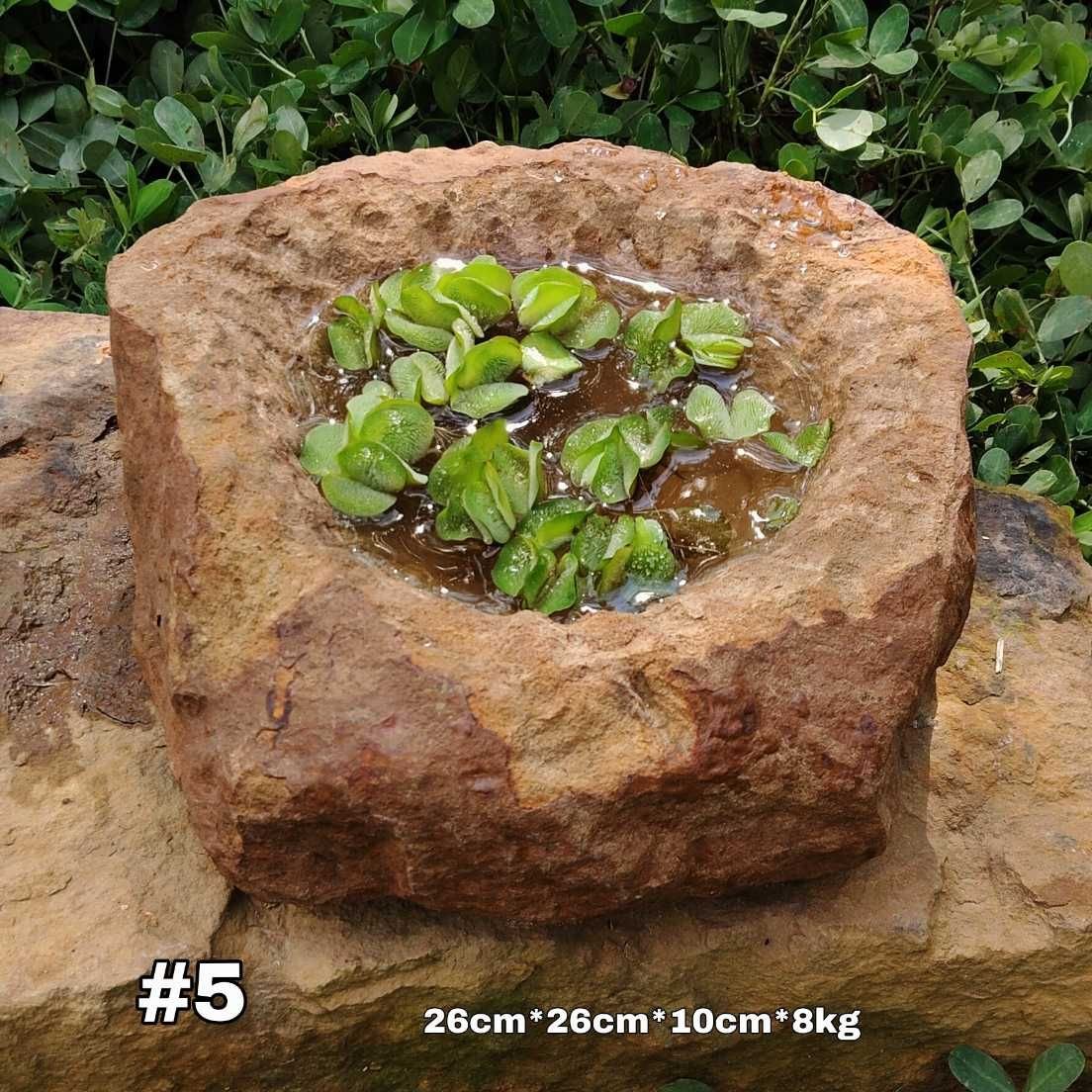 Pila rústica en piedra