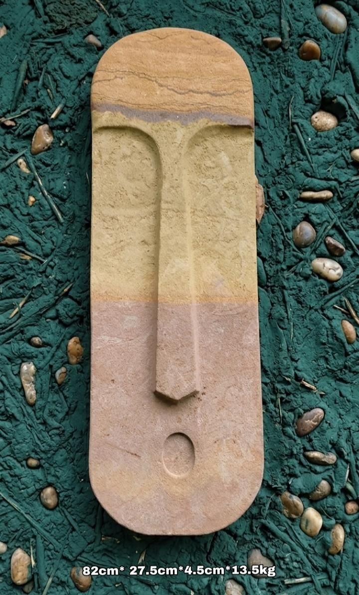 Escultura de pared en piedra