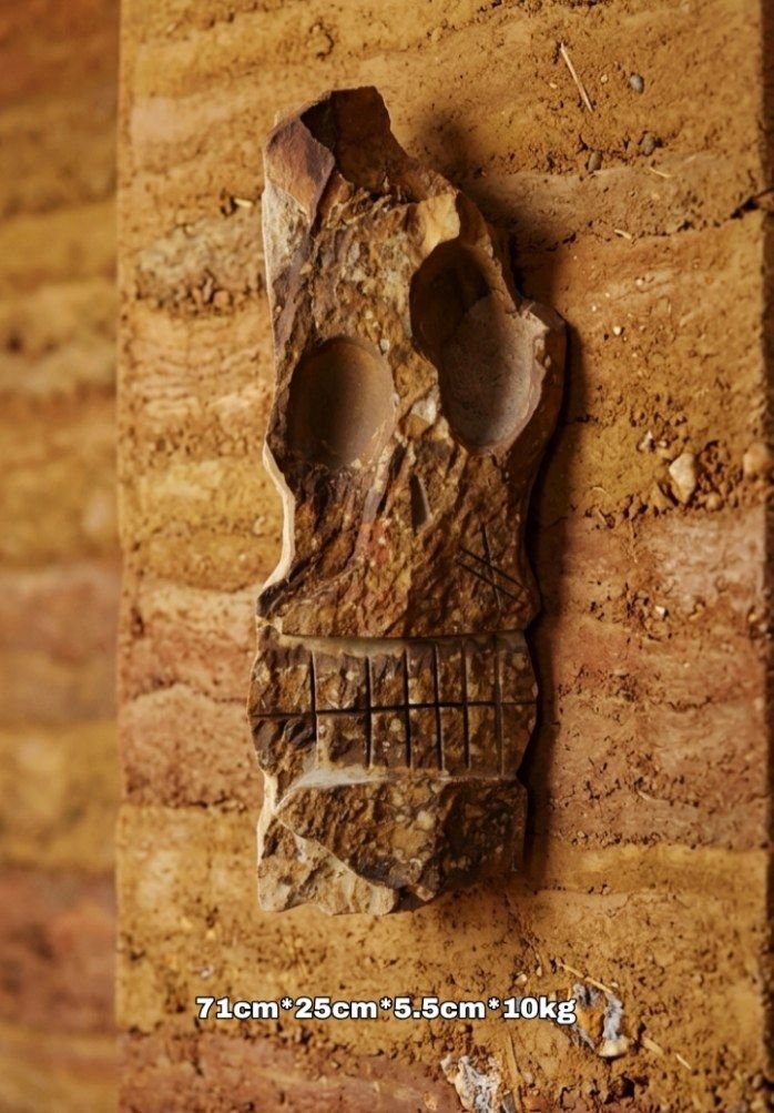 Escultura de pared en piedra